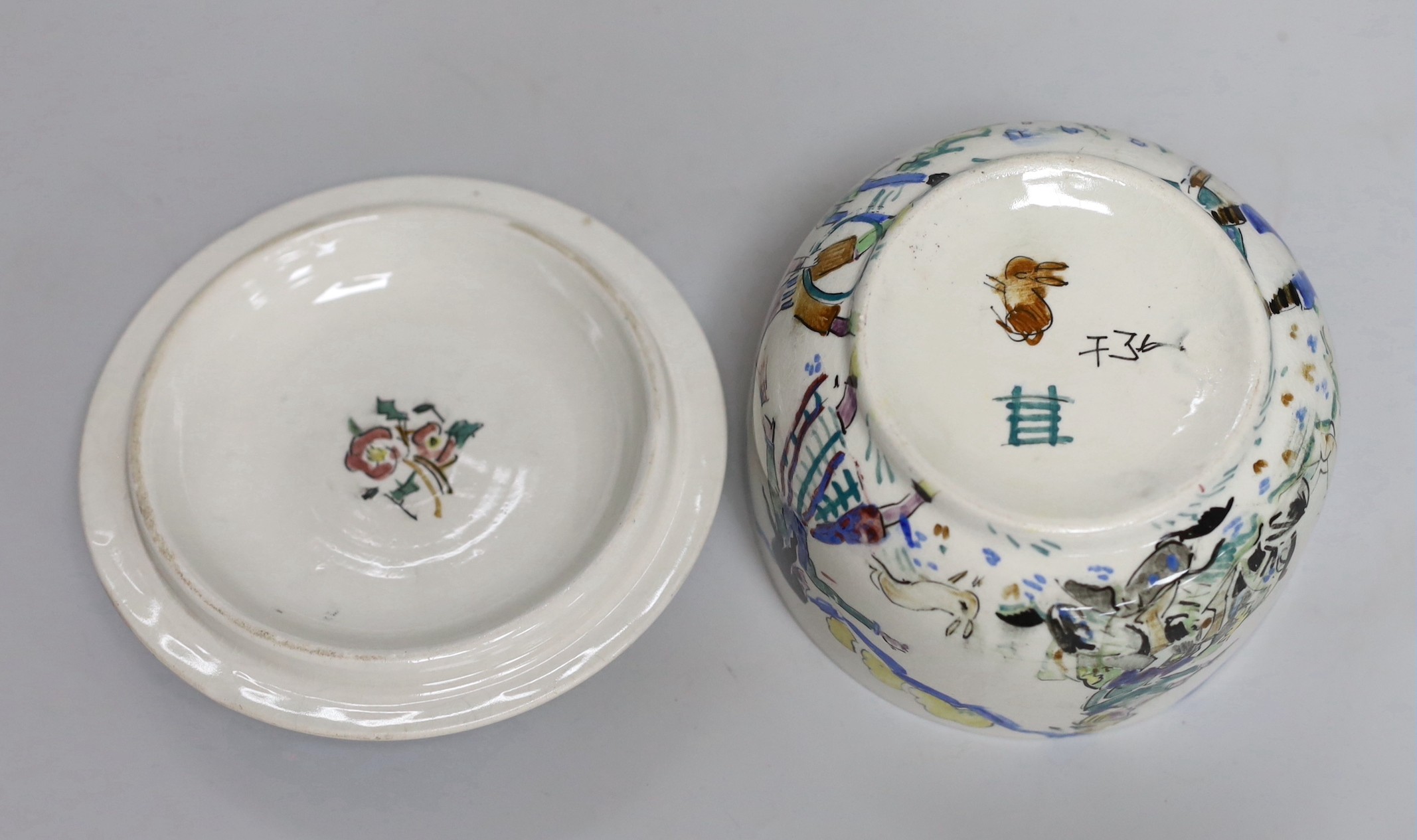Jessie Marion King (1875-1949). A porridge bowl and cover, decorated with children playing, 9cm
